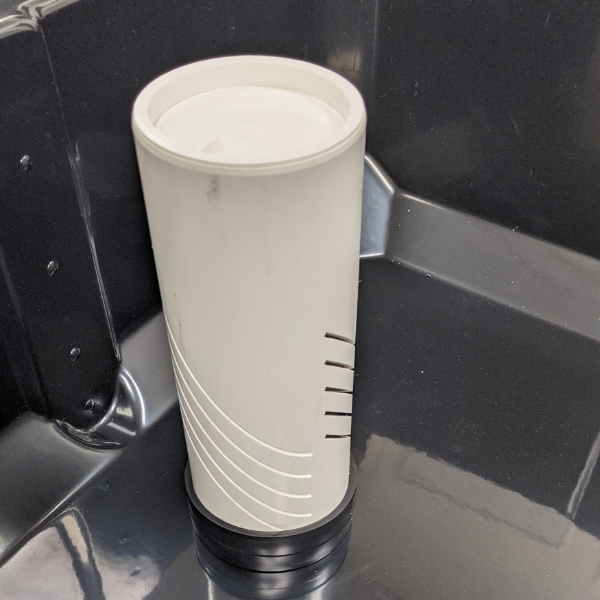 A TAS Locked-in Media Guard sitting in the back of a truck with drainage.