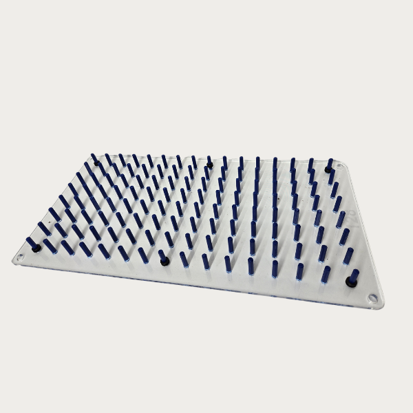 The Plug Tray Popper by TAS is a white rectangular plastic board featuring an array of evenly spaced blue pegs, specifically designed to function as a transplanting tool for seedling trays.