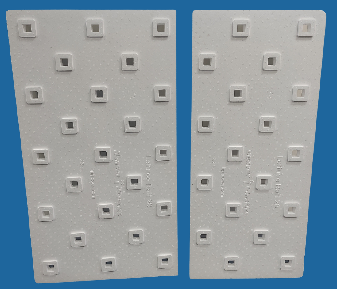 Two white AquaBundance Raft Boards with squares on them, ideal for deep water culture or grow beds, manufactured by Aquaponics For Life.