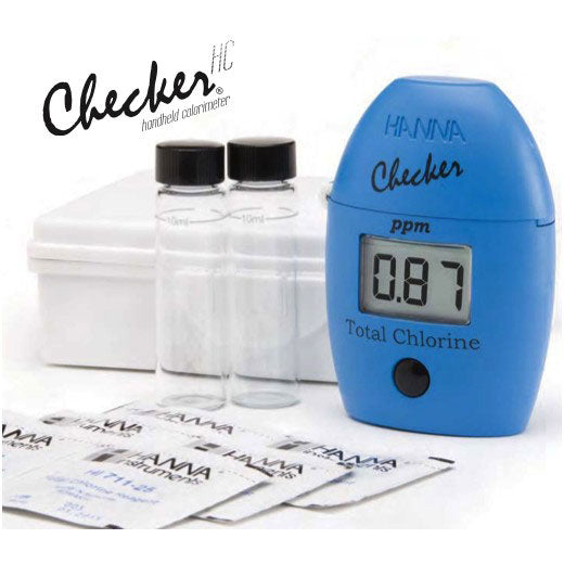 A handheld colorimeter for accurate water testing (TAS Total Chlorine Checker HC) with a display reading 0.87 ppm, two clear vials, a white case, and multiple reagent sachets are shown.