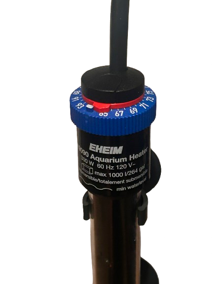 A close-up of the Go Green Aquaponics Eheim Submersible Aquarium Heater - 300w shows its blue temperature dial set near 67°F and specifications on its shatterproof glass body.
