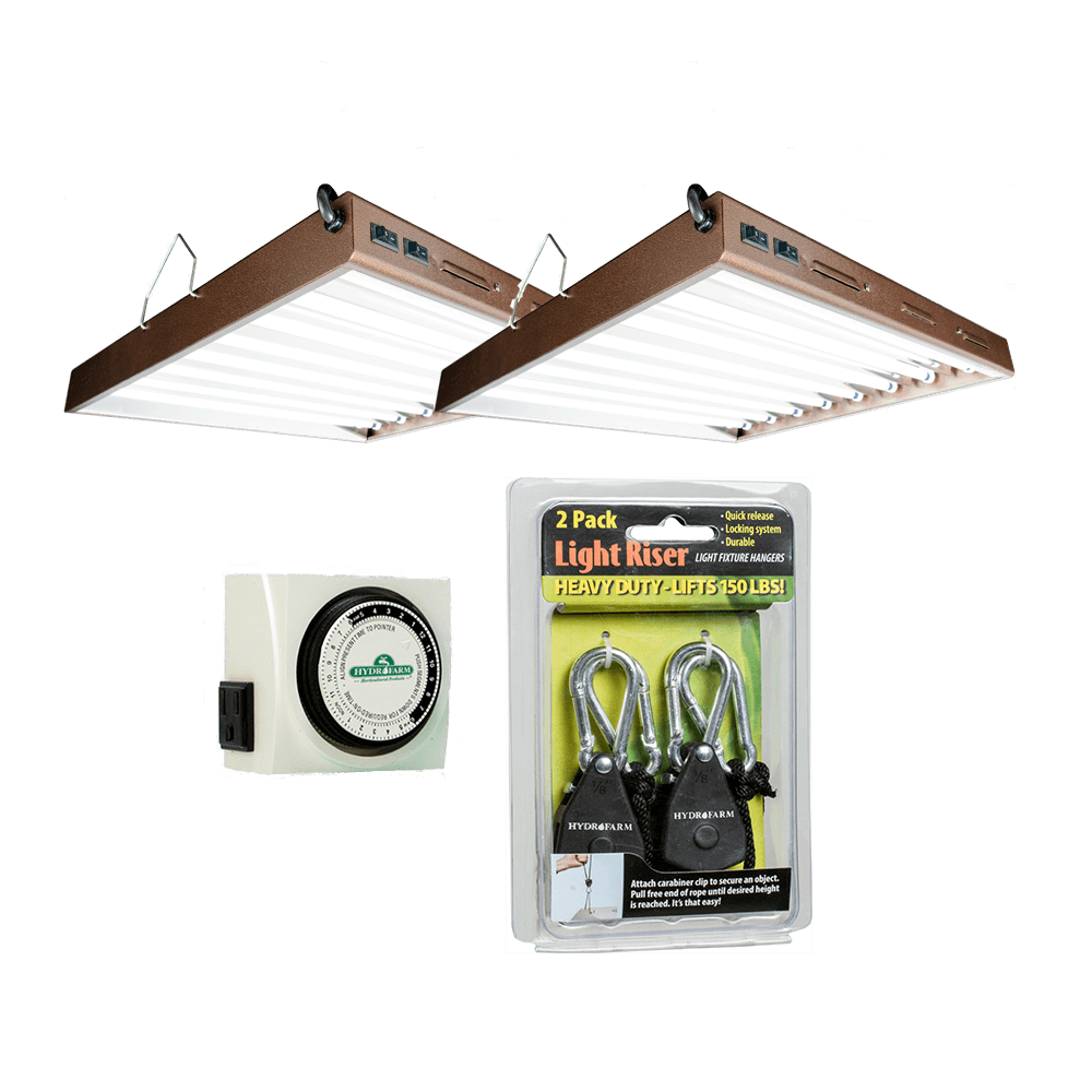 A TAS T5 Economy Lighting Package consisting of two fluorescent grow lights with a timer and a clock, perfect for indoor food production.